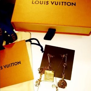 Louis Vuitton mismatched earrings